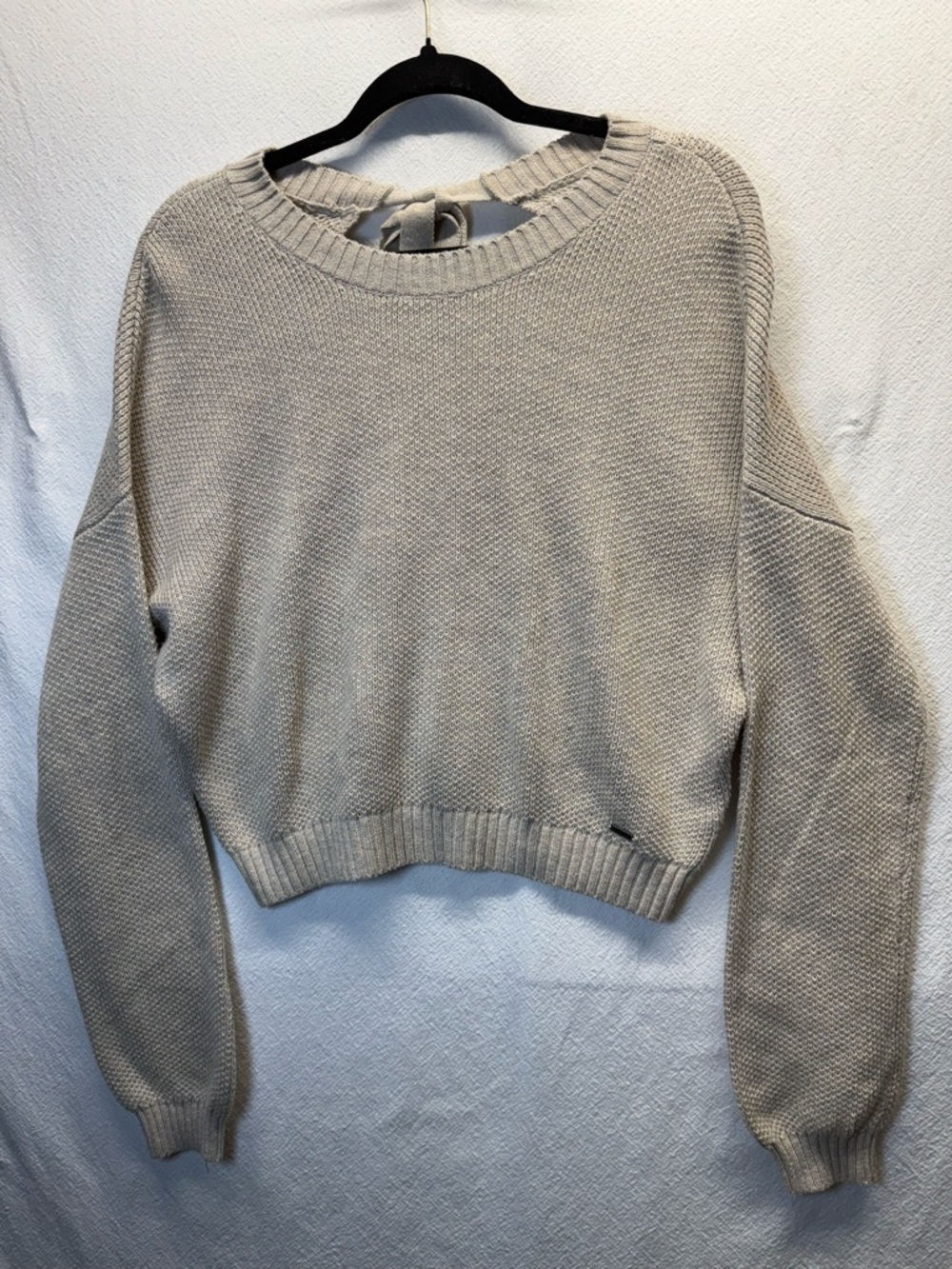 Hollister tan, natural fiber, crop sweater, with open back and tie. Size Med